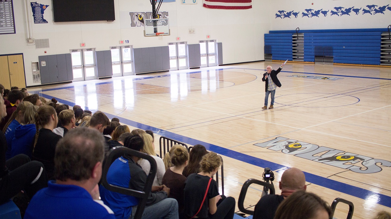 A man standing in front of an audience.